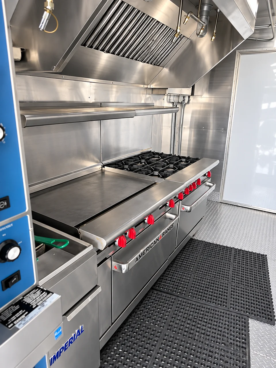 Range and griddle beneath the extraction hood