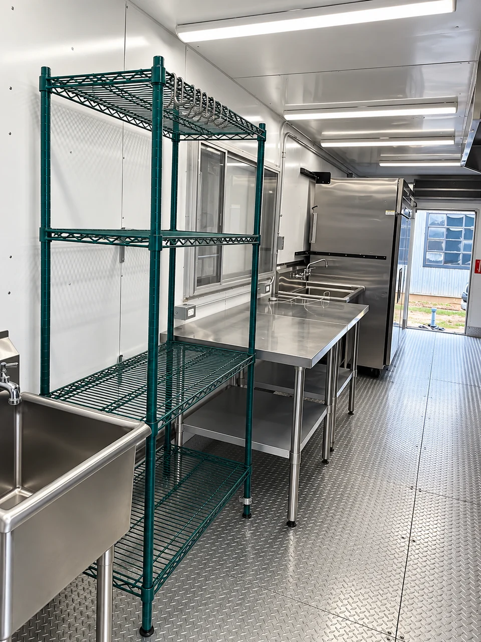 Storage racks and preparation area inside the mobile kitchen