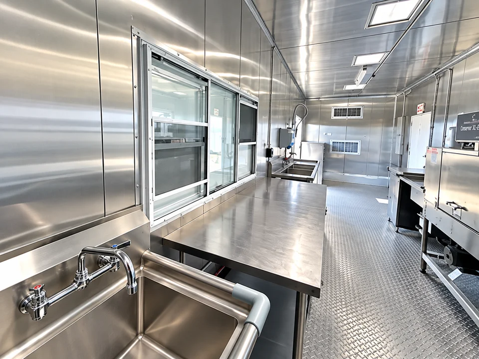 Stainless worktable inside the dishwashing trailer