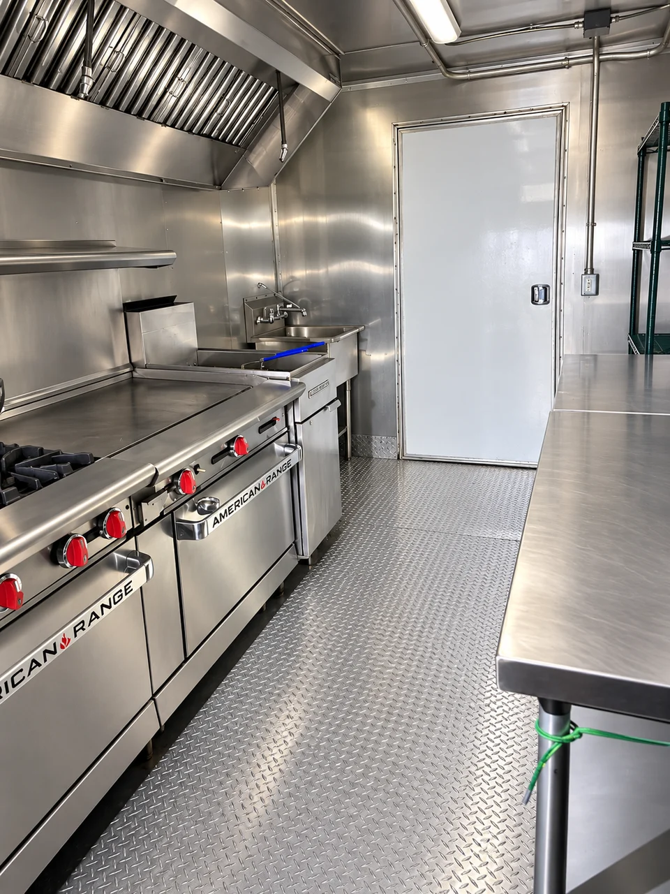 Range, griddle and worktable inside the combination kitchen