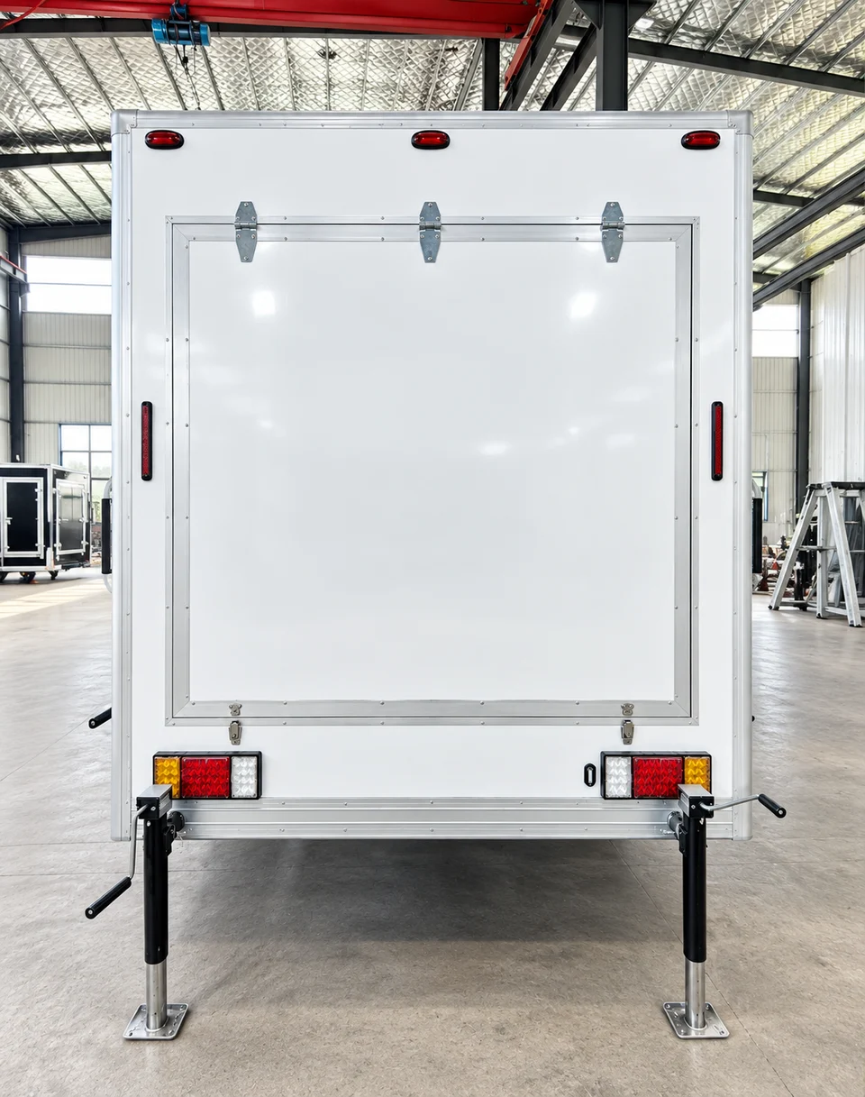 Rear exterior of the shower-only trailer inside a warehouse