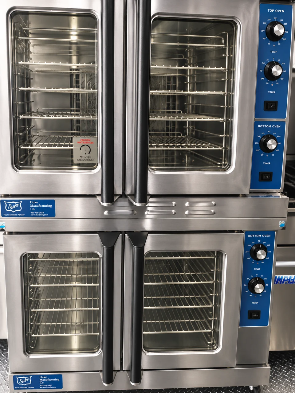 Stacked ovens inside the combination kitchen trailer