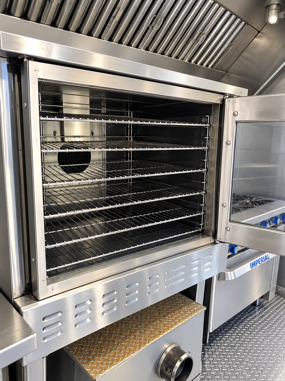 Interior of commercial cooking equipment with metal racks