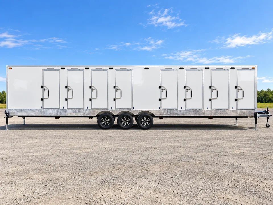 Long shower and restroom trailer with multiple private stall doors