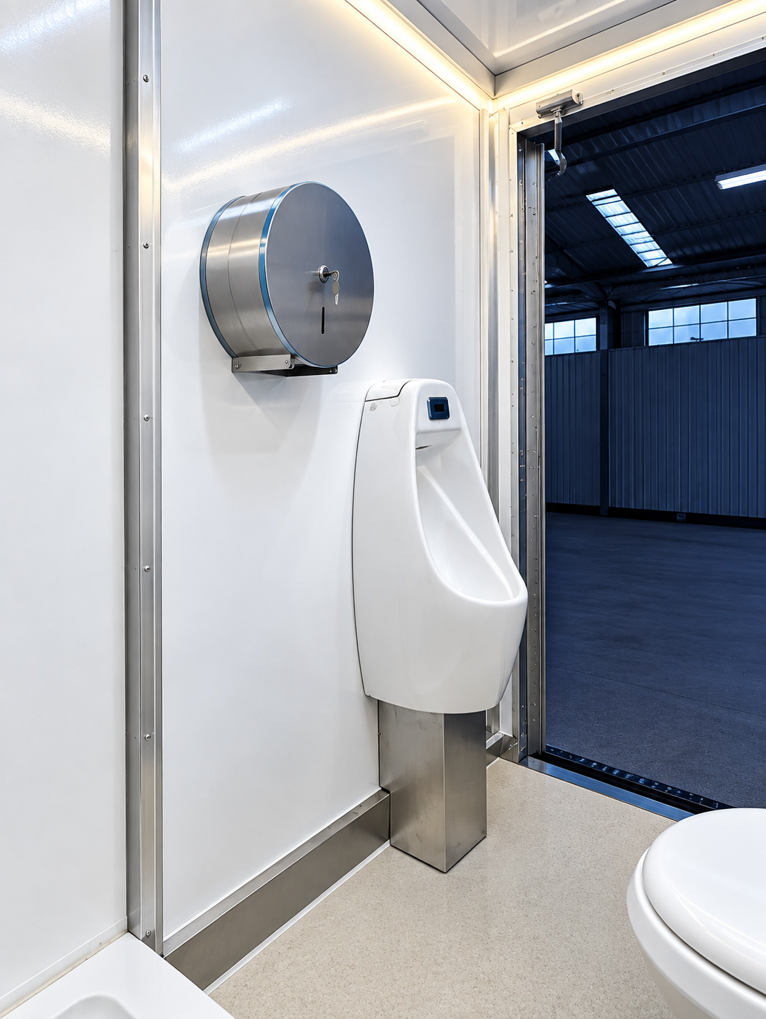 Urinal and handwashing area in a restroom-only trailer reference